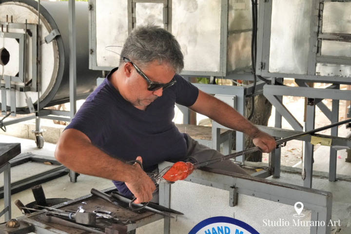 a man preparing food in a pan