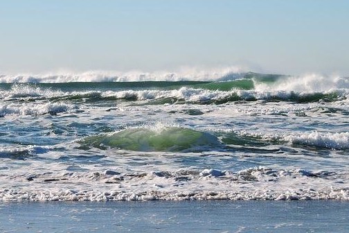 a man riding a wave in the ocean