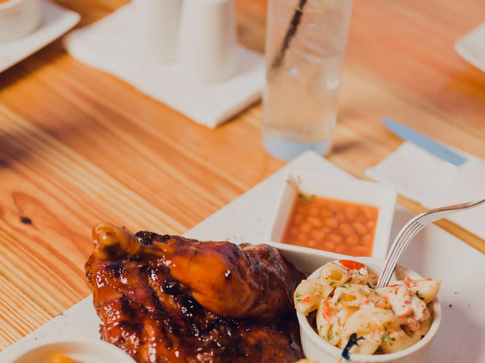 a plate of food sitting on top of a wooden table