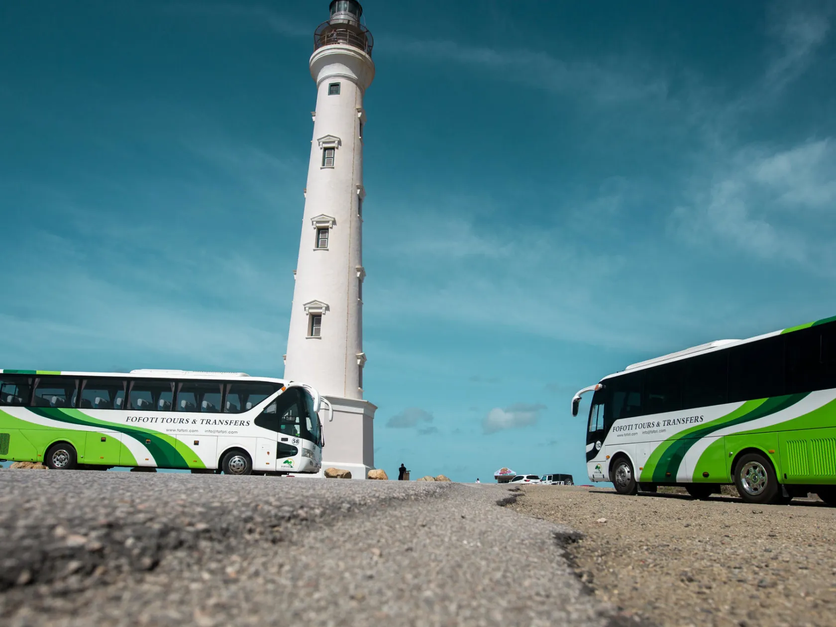 a green truck parked in a parking lot