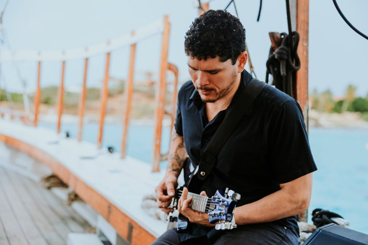 a man standing on a sidewalk