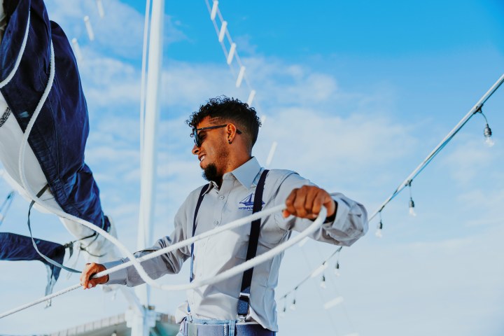 a man flying through the air while riding skis