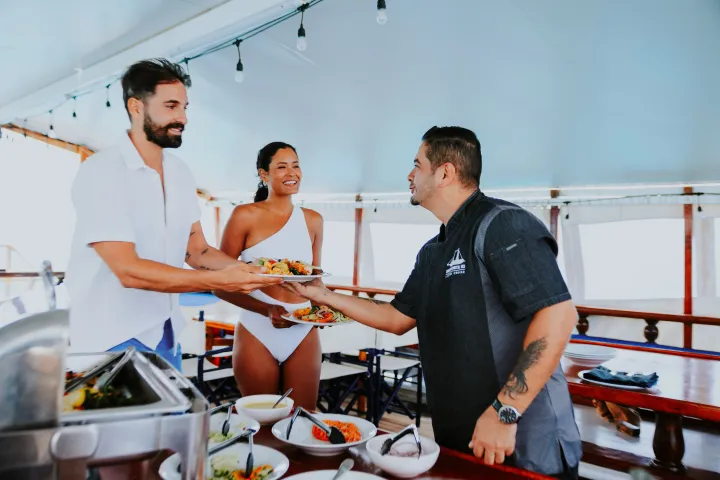 a man cooking in a kitchen preparing food