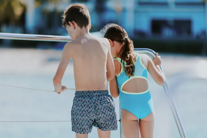 a person standing in front of water