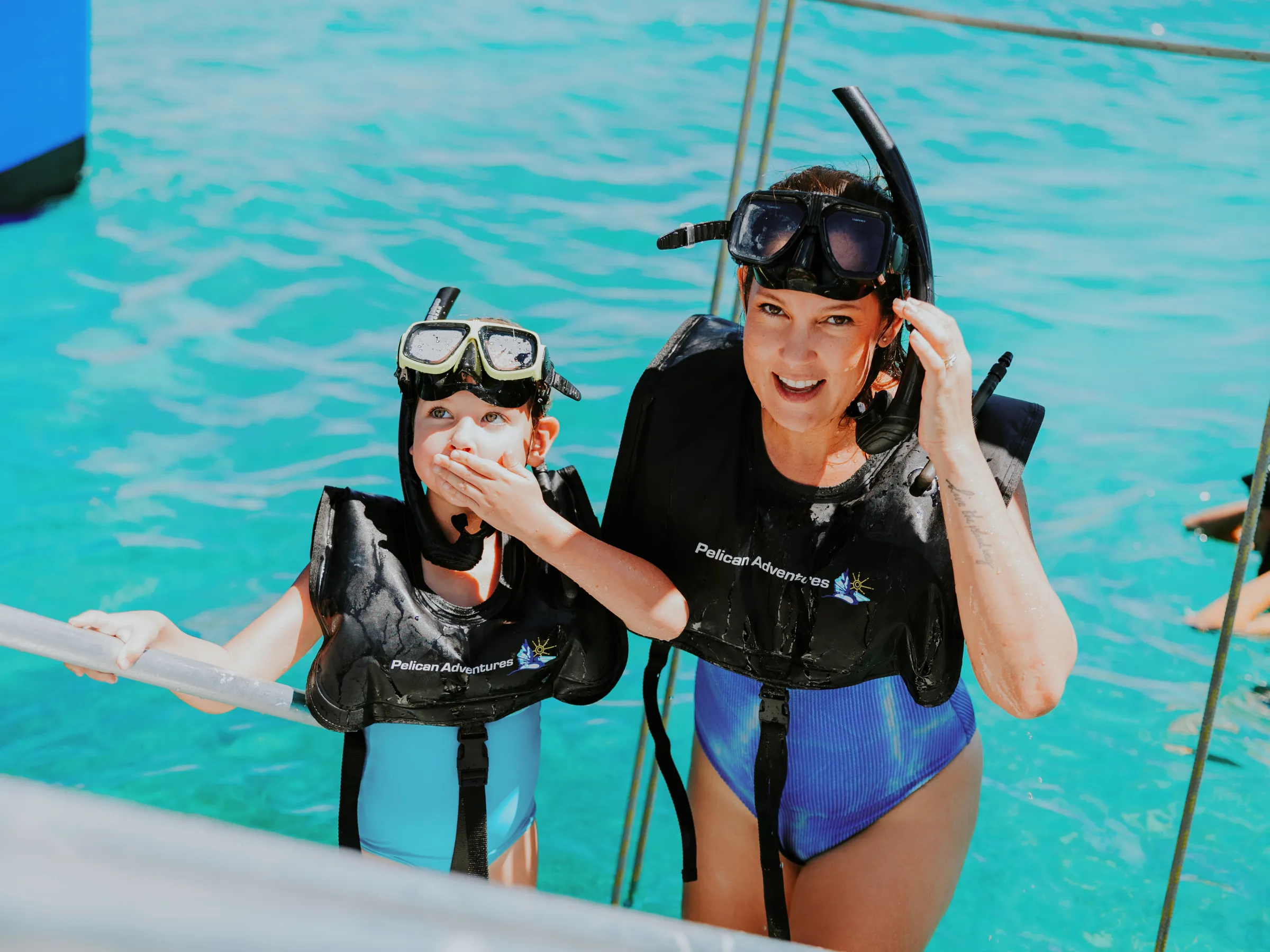 a person standing next to a body of water