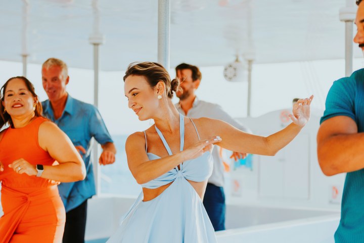 a group of people standing next to a person