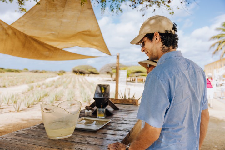 a man standing in front of a table