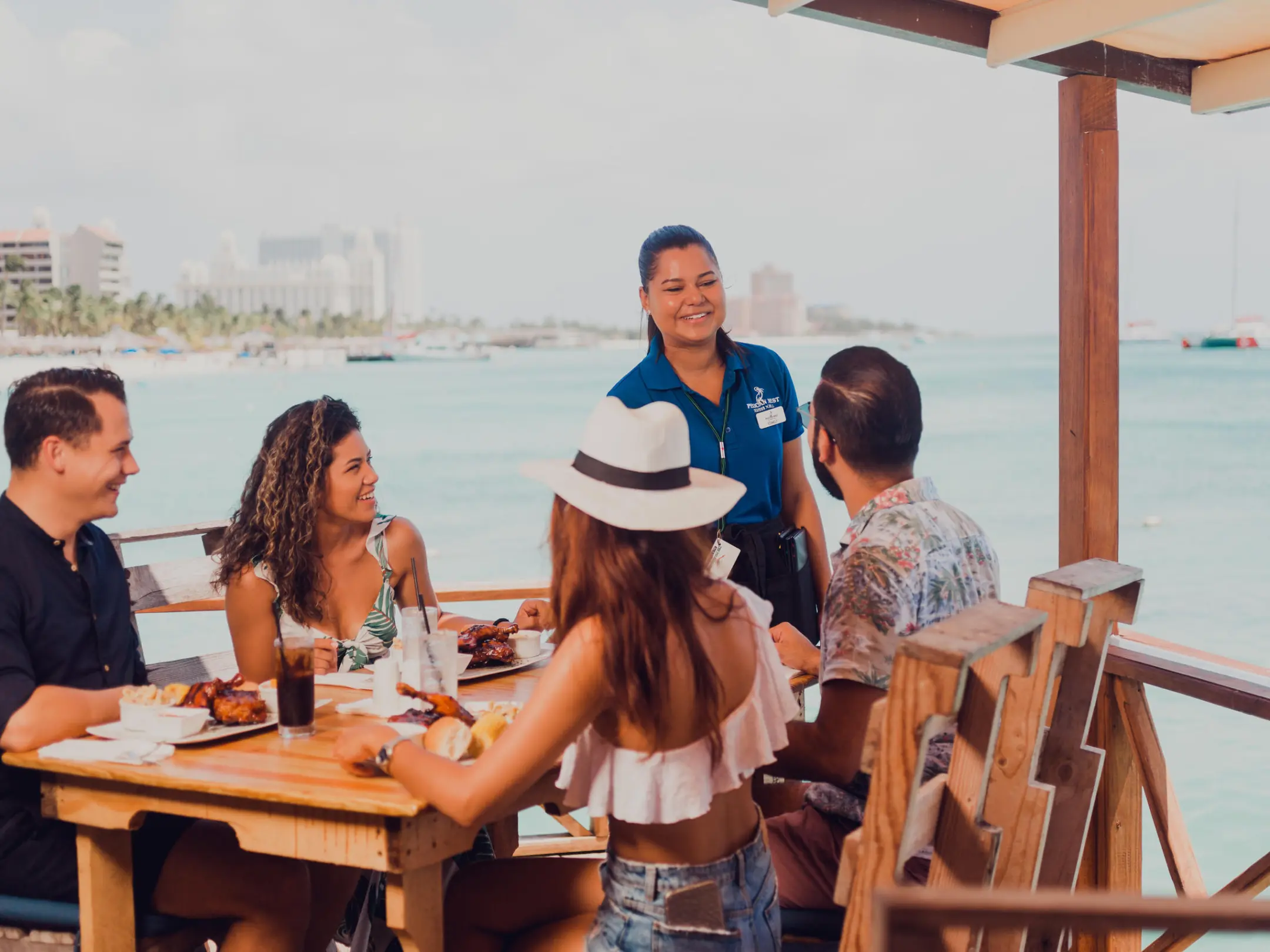 a group of people sitting around a wooden table