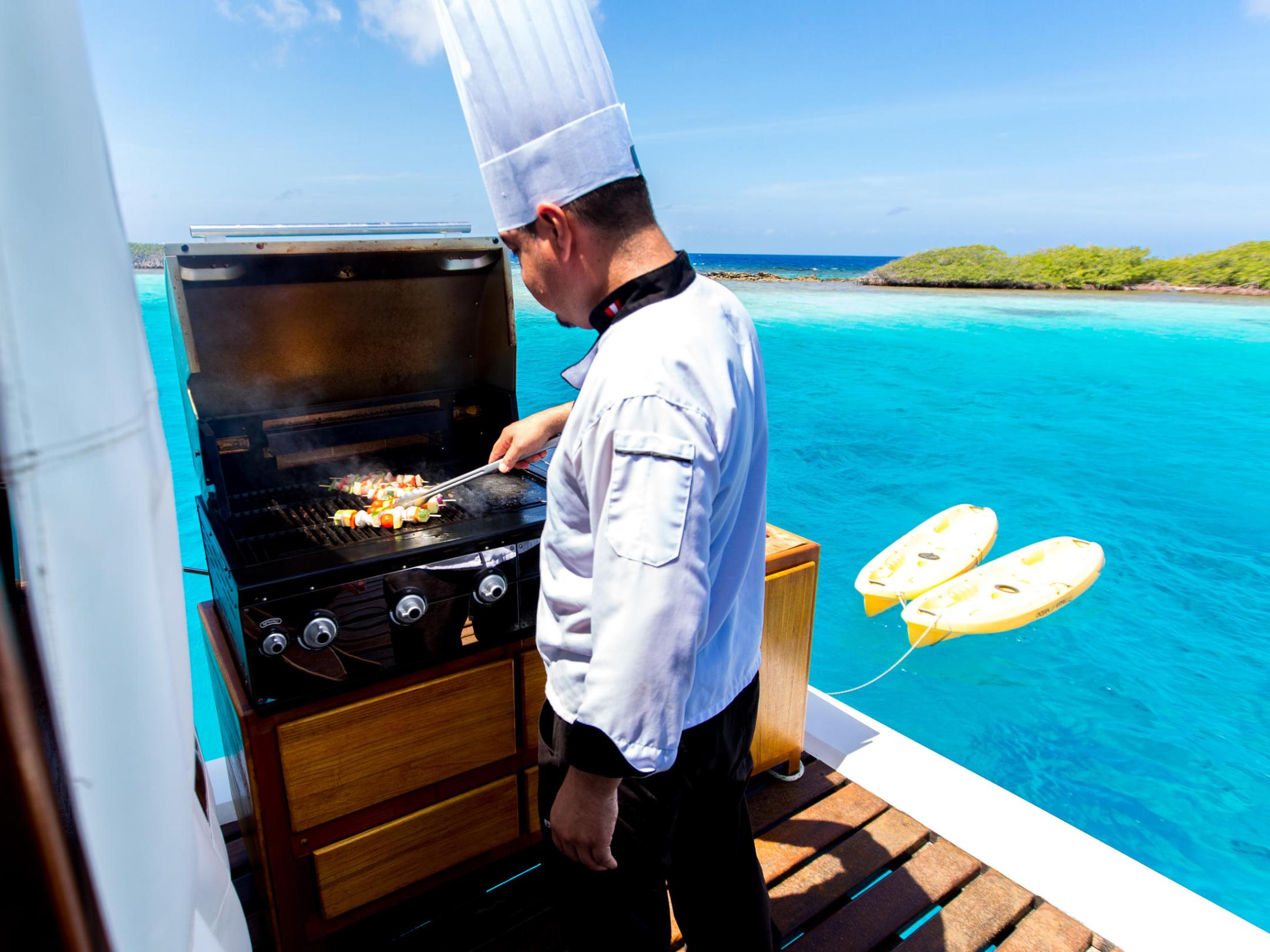 a man standing in front of water