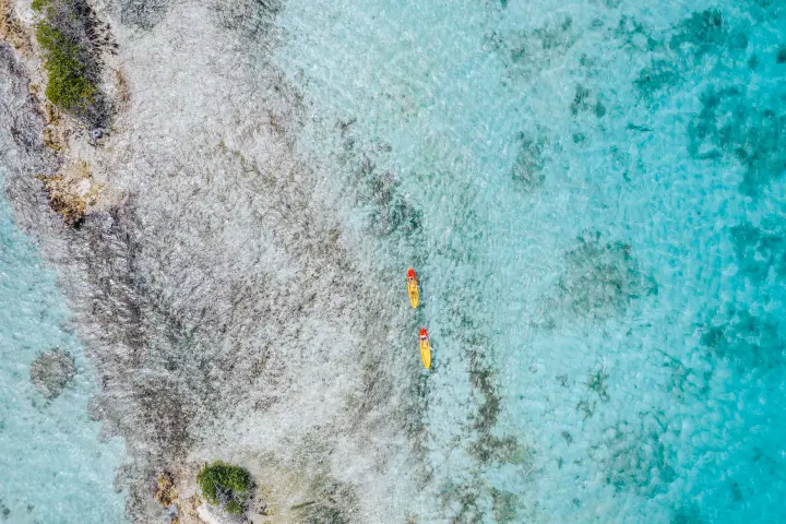 a man riding a wave on a surfboard in the water