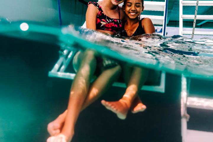 a woman sitting in a pool of water