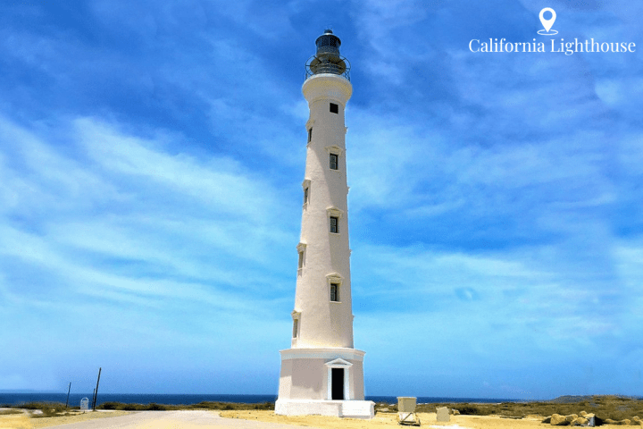 a large clock tower stands against a blue sky