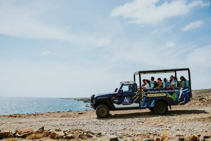 a truck that is sitting on top of a sandy beach