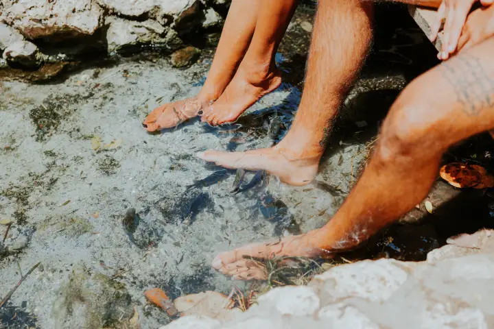 a man that is sitting in the water