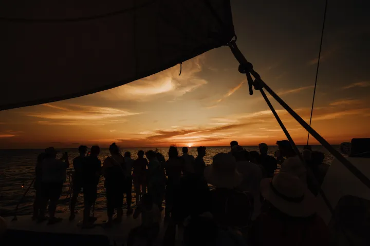 a crowd of people in a dark room
