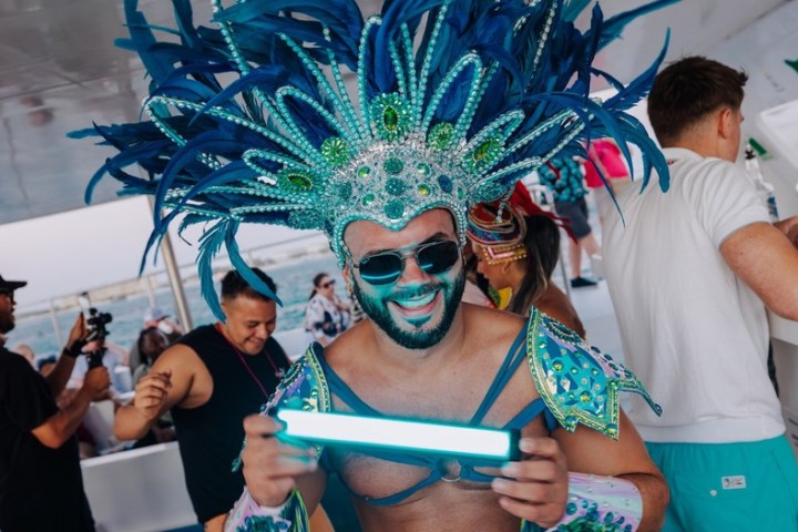 a couple of people that are standing in the kitchen