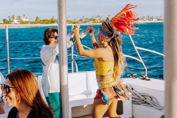 a couple of people that are standing in the water